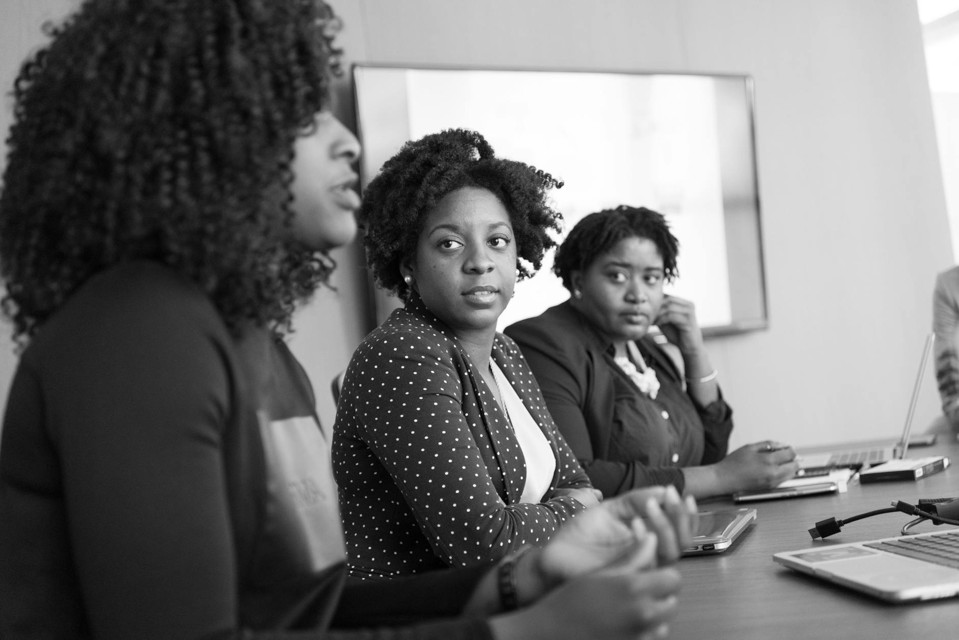 three women in a meeting